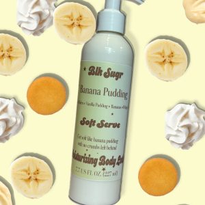 A bottle of Blk Sugr Banana Pudding Soft Serve Lotion on a light yellow background with vanilla wafers, banana slices, and whipped cream swirls.