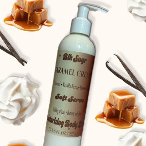 A bottle of Blk Sugr Caramel Crème Soft Serve Lotion on a creamy background, surrounded by caramel drizzles, vanilla beans, and whipped cream.