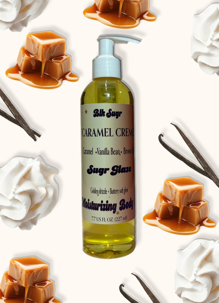 A bottle of Blk Sugr “Caramel Crème” Sugr Glaze body oil on a cream background, surrounded by whipped cream, vanilla beans, and dripping caramel pieces. The label highlights caramel, vanilla bean, and brown sugar notes.