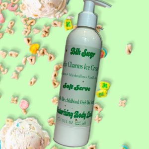 A bottle of Blk Sugr Lucky Charms Ice Cream Soft Serve Lotion on a green background with cereal marshmallows, vanilla ice cream scoops, and colorful charms scattered around.
