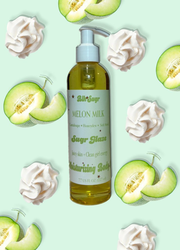 A bottle of Blk Sugr “Melon Milk” Sugr Glaze body oil on a mint green background, surrounded by sliced honeydew melons and whipped cream swirls. The label highlights cantaloupe, honeydew, and soft musk notes.