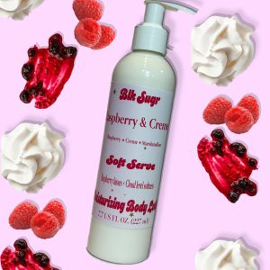 A bottle of Blk Sugr Raspberry & Creme Soft Serve Lotion on a pink background with fresh raspberries, raspberry jam swirls, and whipped cream dollops.