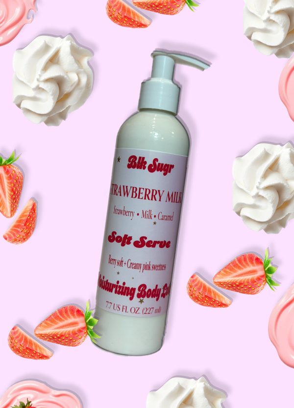 A bottle of Blk Sugr Strawberry Milk Soft Serve Lotion on a pink background, surrounded by strawberries, cream, and caramel drizzles.