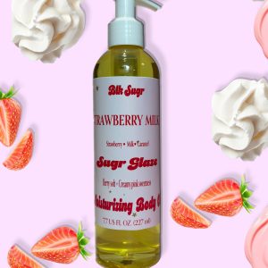 A bottle of Blk Sugr “Strawberry Milk” Sugr Glaze body oil on a light pink background, surrounded by fresh strawberries, whipped cream, and strawberry milk swirls. The label lists notes of strawberry, milk, and caramel.