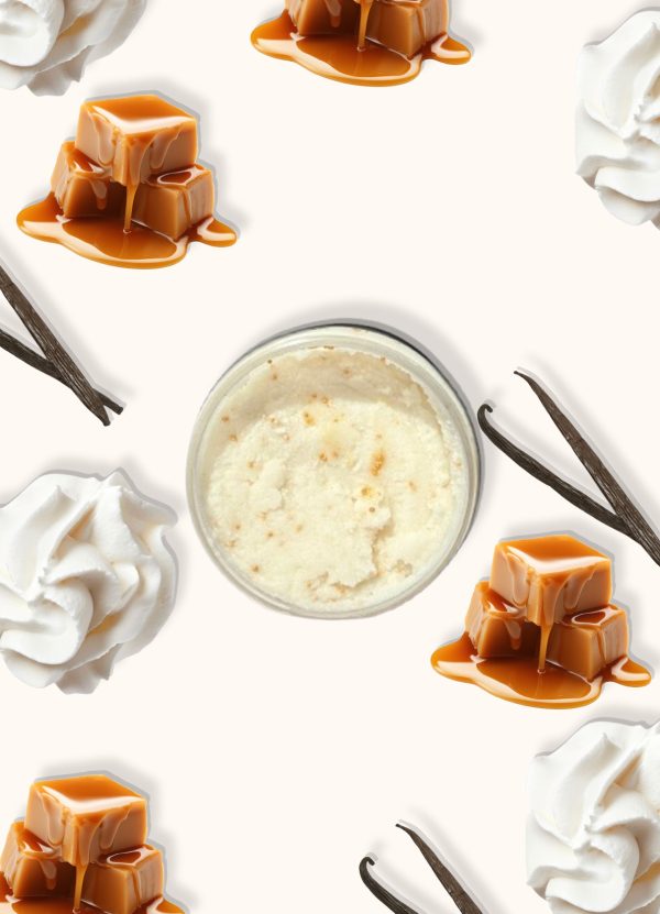 A jar of Blk Sugr Caramel Vanilla Swirl Sugr Buff surrounded by caramel drizzle, whipped cream, and vanilla bean pods on a creamy beige background.